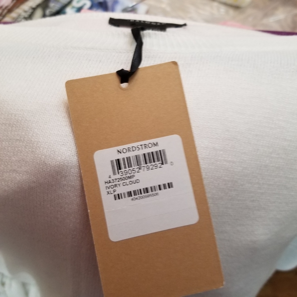 White sweater with a ruffle